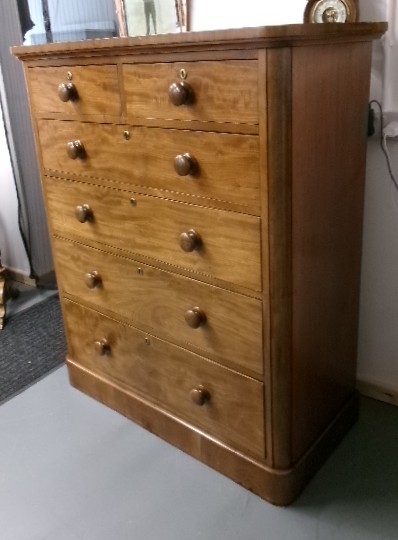 A tall Victorian mahogany chest of drawers featuring two short upper drawers above four long drawers with turned wooden knobs and a solid plinth base. View XI