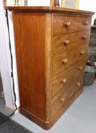 A tall Victorian mahogany chest of drawers featuring two short upper drawers above four long drawers with turned wooden knobs and a solid plinth base. View XII