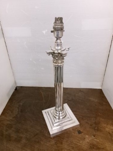 A Victorian silver-plated table lamp shaped as a fluted Corinthian column resting on a stepped square base. View III