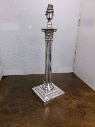 A Victorian silver-plated table lamp shaped as a fluted Corinthian column resting on a stepped square base. View IV