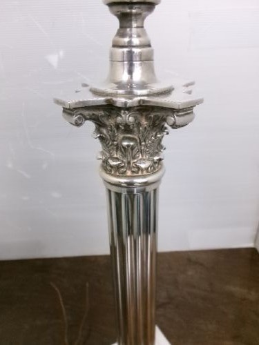 A Victorian silver-plated table lamp shaped as a fluted Corinthian column resting on a stepped square base. View V