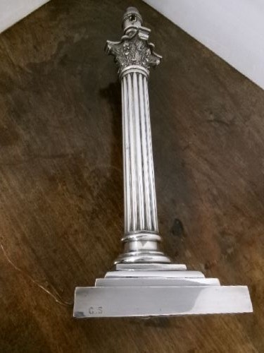 A Victorian silver-plated table lamp shaped as a fluted Corinthian column resting on a stepped square base. View VII