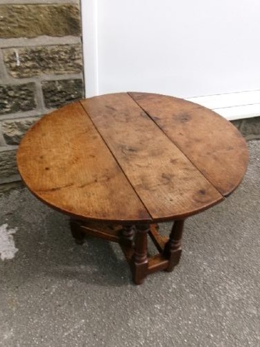 A compact Georgian oak and elm gateleg table with two drop leaves, turned legs, and lower stretchers. View II