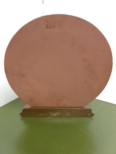 An Art Deco spelter figure of a dancing female posing dynamically in front of a circular bevelled glass mirror set on a wooden plinth base. View IV
