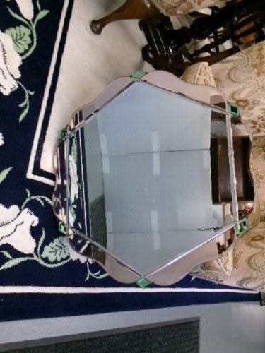 An Art Deco frameless wall mirror featuring peach-tinted geometric border panels, green corner clips, and a scalloped edge silhouette. View II