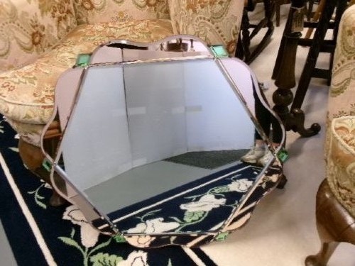 An Art Deco frameless wall mirror featuring peach-tinted geometric border panels, green corner clips, and a scalloped edge silhouette. View IV