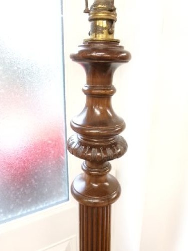 A dark turned mahogany standard lamp with a fluted central column and a moulded circular base. View IV