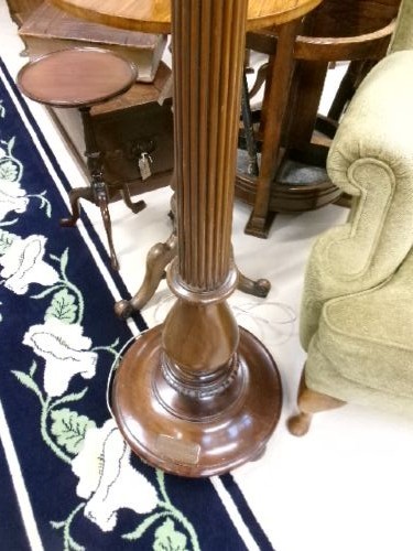 A dark turned mahogany standard lamp with a fluted central column and a moulded circular base. View X