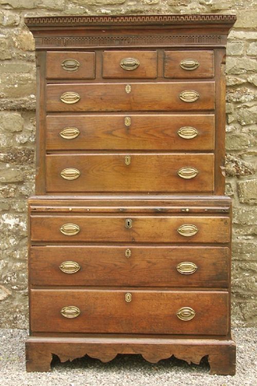 fig 1. An 18th-century Welsh oak tallboy chest-on-chest with brass oval handles, dentil moulding at the cornice, and a shaped apron base.