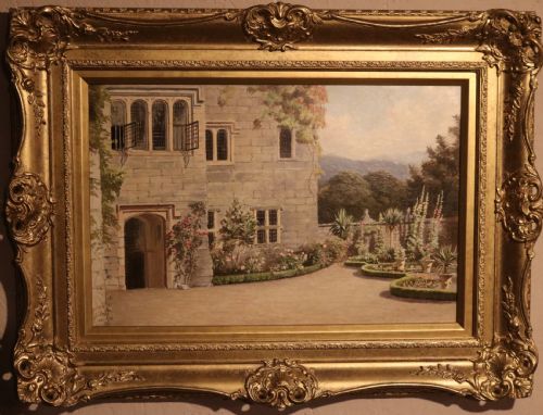 fig 1. A 19th-century landscape oil painting depicting a formal garden pathway leading towards a stone manor house, enclosed within an ornate gold giltwood frame.