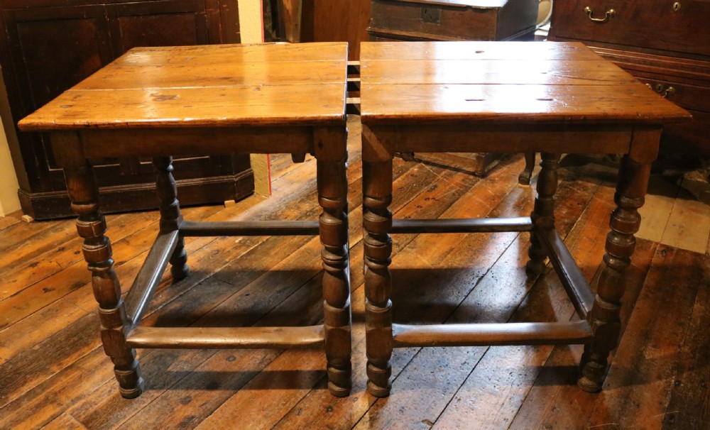 A long Basque chestnut extending dining table with a plank top, turned legs, and perimeter stretchers. View III