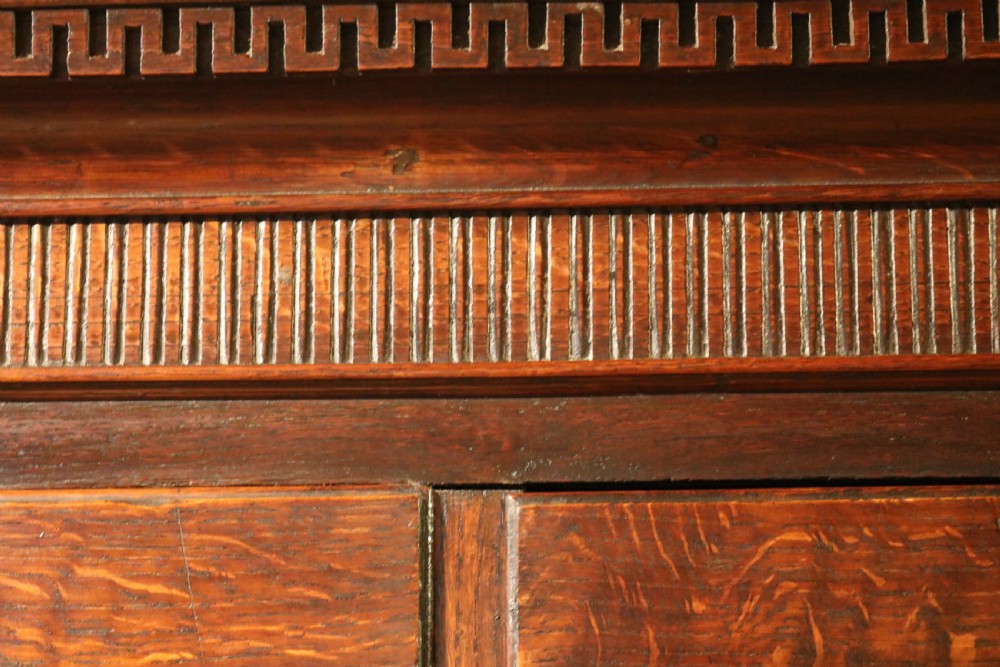 A Georgian Welsh oak tallboy chest-on-stand featuring brass swan-neck handles, a dentil-moulded cornice, and cabriole legs. View VII