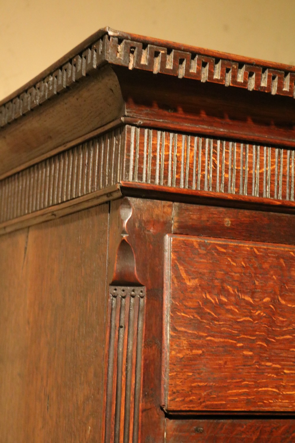 A Georgian Welsh oak tallboy chest-on-stand featuring brass swan-neck handles, a dentil-moulded cornice, and cabriole legs. View VIII