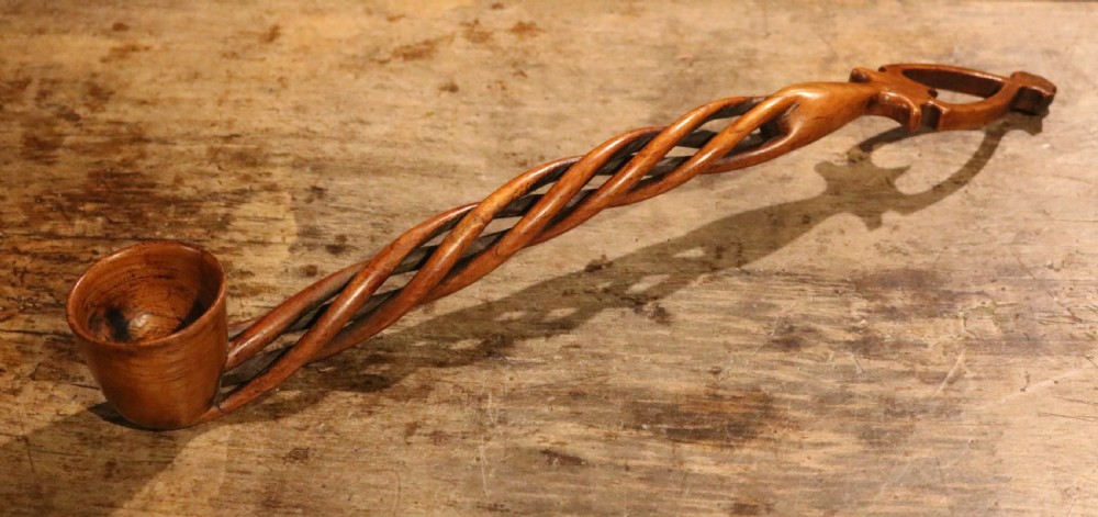 An early nineteenth-century carved Welsh fruitwood lovespoon featuring an openwork spiral stem and a deep bowl. View II