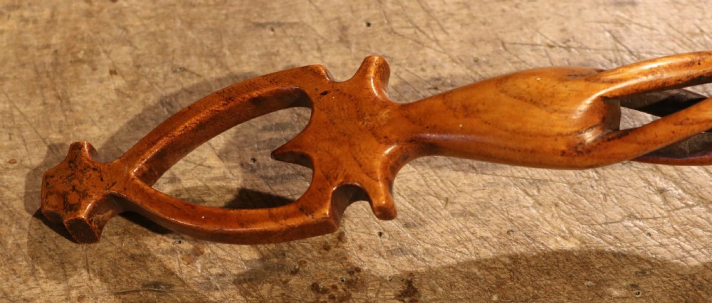 An early nineteenth-century carved Welsh fruitwood lovespoon featuring an openwork spiral stem and a deep bowl. View VI