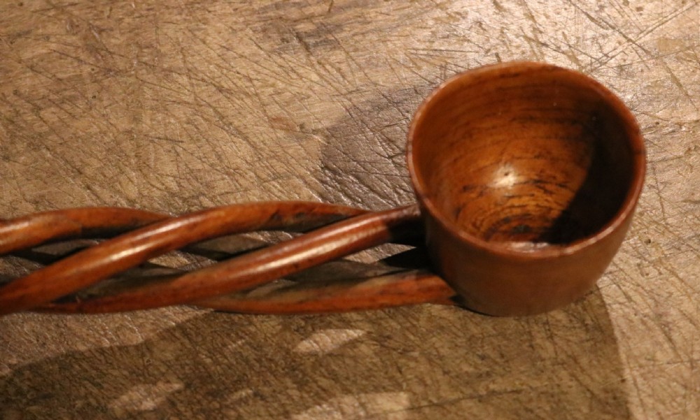 An early nineteenth-century carved Welsh fruitwood lovespoon featuring an openwork spiral stem and a deep bowl. View VII