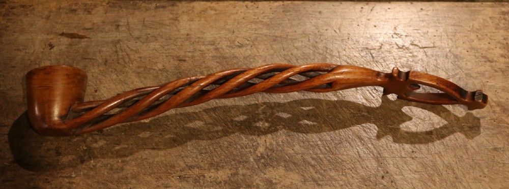 An early nineteenth-century carved Welsh fruitwood lovespoon featuring an openwork spiral stem and a deep bowl. View X