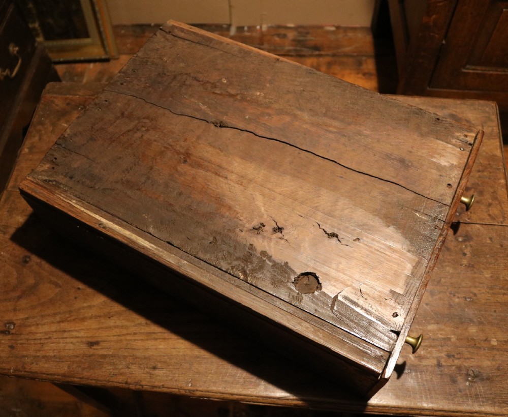 An eighteenth-century Welsh oak deuddarn two-part cupboard featuring a moulded cornice, three upper panelled doors with ogee arches, three mid drawers, and a lower cabinet with field panelled doors. View XII