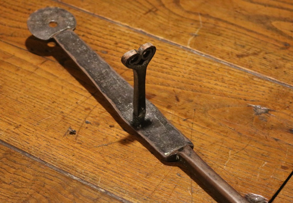 A Georgian brass hearth skillet featuring a rounded brass bowl joined to a long wrought iron handle with an integrated support rest. View III