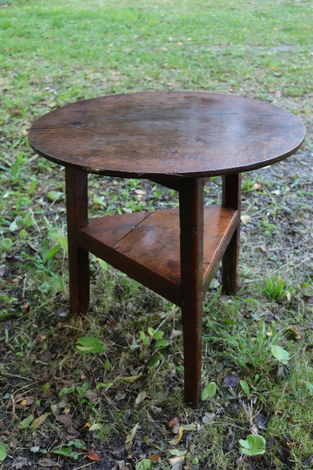 A Georgian three-legged oak cricket table featuring a circular top and a lower triangular stretcher shelf. View III