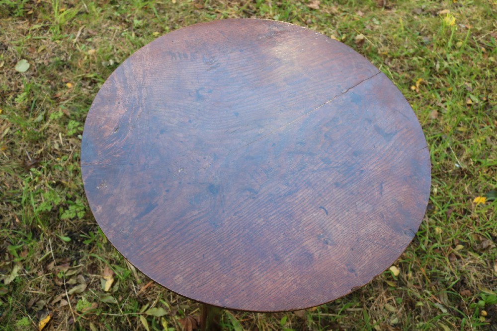 A Georgian three-legged oak cricket table featuring a circular top and a lower triangular stretcher shelf. View VI