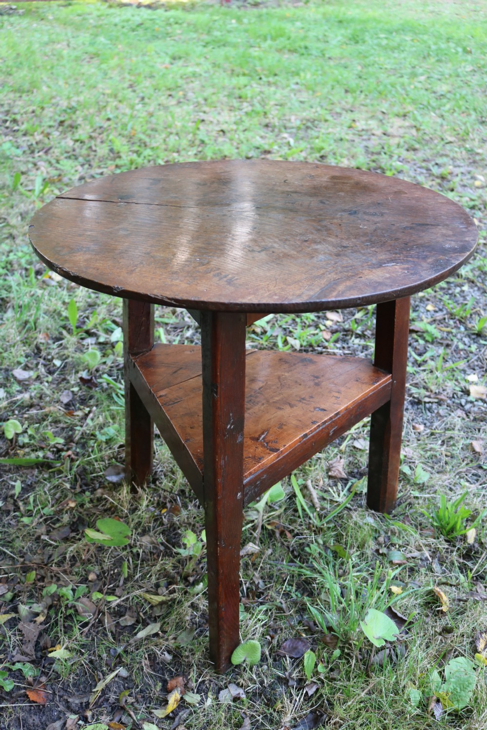A Georgian three-legged oak cricket table featuring a circular top and a lower triangular stretcher shelf. View VIII
