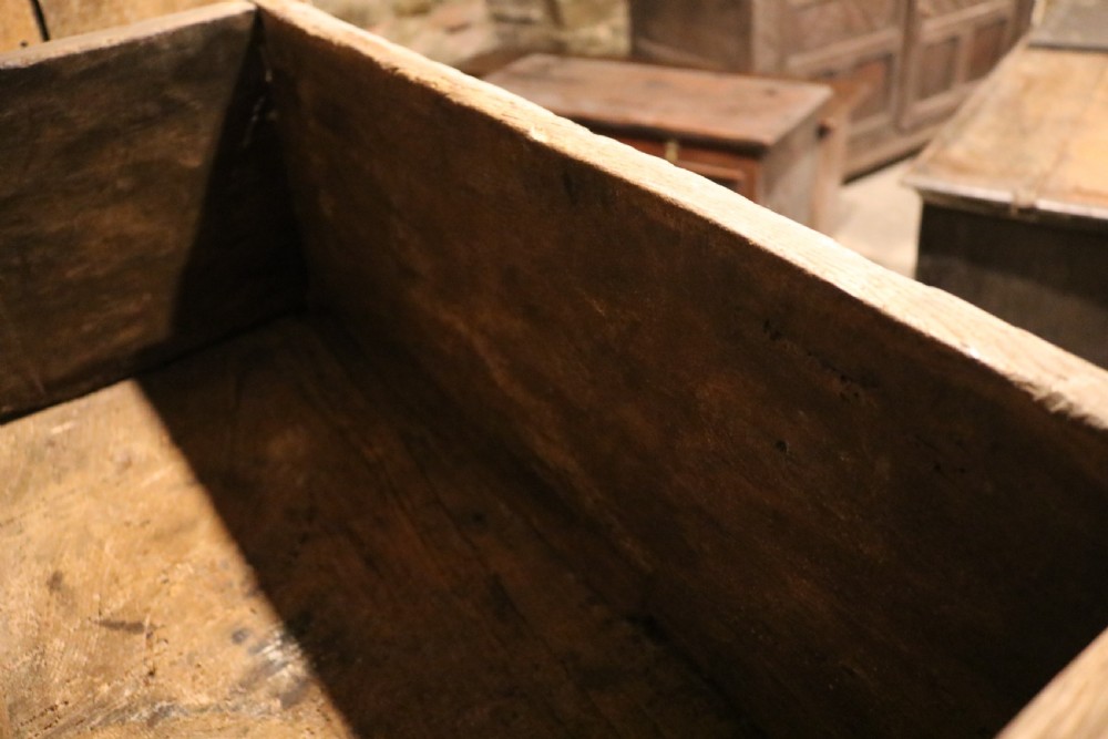 An antique dark brown chestnut wood deed box featuring carved Gothic arch panels and a hand-forged iron lock plate on the front. View XIII