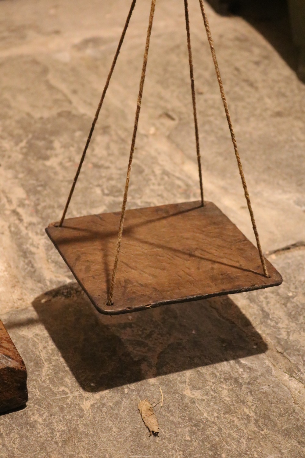 A Georgian turned oak balance scale featuring two wooden square pans suspended by cords from a wooden crossbar. View III