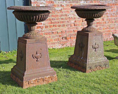 fig 2. Pair of Victorian cast iron planters classical urns on plinths