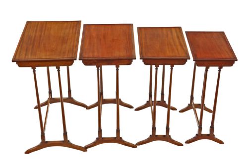 fig 2. A set of four antique mahogany nesting tables with turned spindle legs, inlaid edge borders, and flared splayed feet.