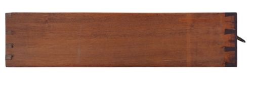 fig 3. A Georgian Revival mahogany chest of drawers with four graduated drawers, brass ring handles, boxwood inlay, and bracket feet.