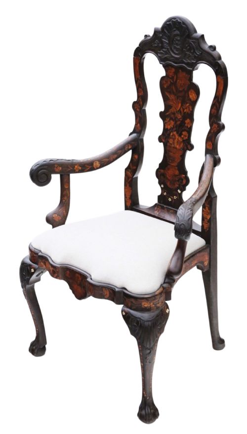 fig 2. An 18th-century Dutch marquetry armchair featuring intricate floral wood inlays, carved cabriole legs with claw-and-ball feet, curved armrests, and a cream upholstered seat.