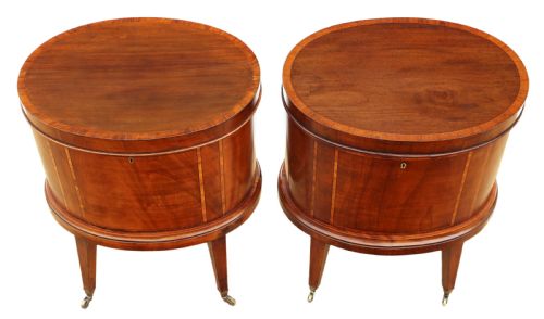 fig 1. A pair of 19th-century oval mahogany cellarettes with line inlay, escutcheons, tapered legs, and brass castors.