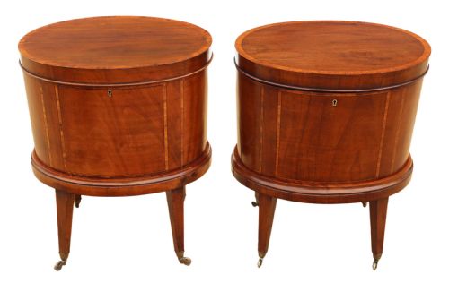 fig 2. A pair of 19th-century oval mahogany cellarettes with line inlay, escutcheons, tapered legs, and brass castors.
