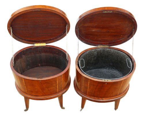 fig 3. A pair of 19th-century oval mahogany cellarettes with line inlay, escutcheons, tapered legs, and brass castors.