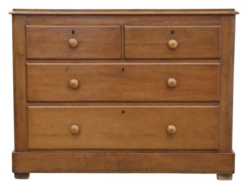 fig 3. Victorian pine chest of drawers featuring two short drawers over two long drawers with turned wooden knobs and keyhole escutcheons.