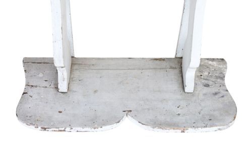 fig 2. A pair of 19th-century wall-mounted wooden shelves featuring five tiers with shaped, curved upright supports in a distressed white painted finish.