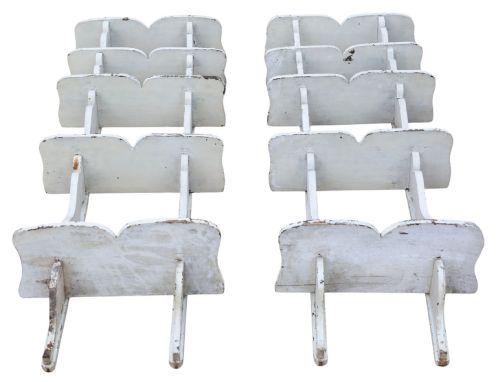 fig 5. A pair of 19th-century wall-mounted wooden shelves featuring five tiers with shaped, curved upright supports in a distressed white painted finish.