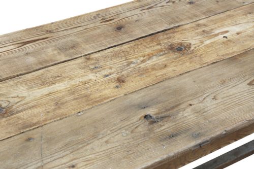 fig 3. A long 19th-century pine refectory dining table featuring a three-plank top, six tapered square legs, and an H-stretcher base.