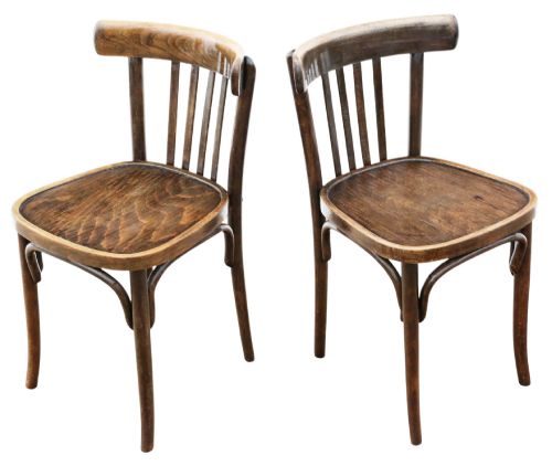 fig 1. A pair of dark brown bentwood bistro dining chairs featuring vertical back spindles, steam-bent frames, and contoured wood seats.