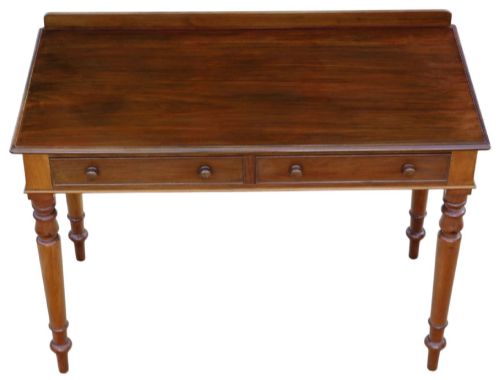 fig 2. A 19th-century mahogany writing and dressing table featuring two frieze drawers with turned handles, a low gallery back, and tapered turned legs.