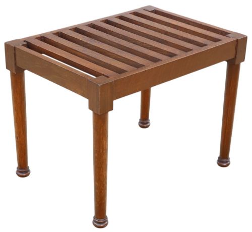 fig 1. An antique mahogany luggage stand featuring a slatted timber top and four turned legs with collared feet.
