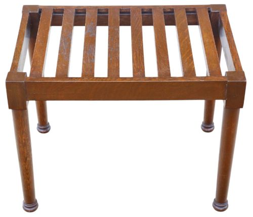 fig 2. An antique mahogany luggage stand featuring a slatted timber top and four turned legs with collared feet.