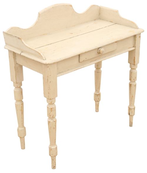 fig 2. A 19th-century cream painted wooden writing table featuring a shaped gallery back, turned legs, and a single central drawer with a turned wooden knob.