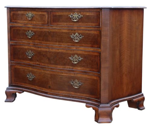fig 3. A serpentine-front burr walnut chest of drawers featuring crossbanded borders, cast brass handles, and ogee bracket feet.