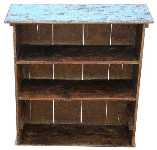 fig 3. A 19th-century rustic open-front wooden bookcase with distressed light blue paint on the exterior and dark stained wood interior shelves.