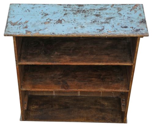 fig 4. A 19th-century rustic open-front wooden bookcase with distressed light blue paint on the exterior and dark stained wood interior shelves.