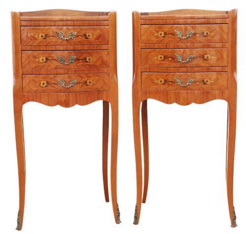 fig 1. A pair of slim French style bedside tables featuring floral marquetry wood inlays, three drawers with brass handles, and slender cabriole legs.
