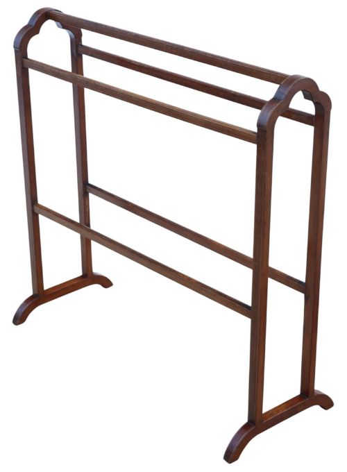 fig 1. An Edwardian mahogany towel rail featuring arched side supports, fine line inlay, three upper hanging bars, lower stretchers, and splayed feet.