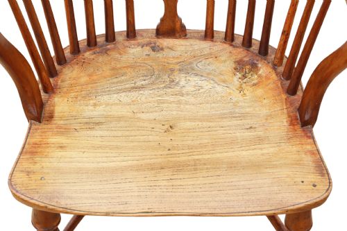 fig 4. A 19th-century yew and elm Windsor armchair featuring a hoop back, pierced central splat, turned legs, and a crinoline stretcher.